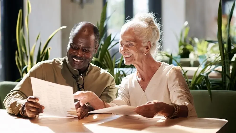 Happy-Seniors-Reviewing-Paperwork